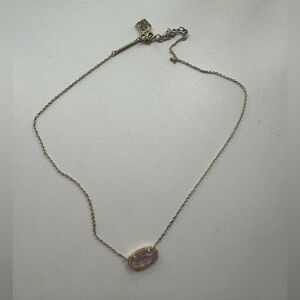 purple and sparkly kendra scott necklaces